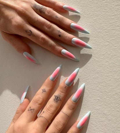 Megan Fox very sharp stiletto nails with aura design