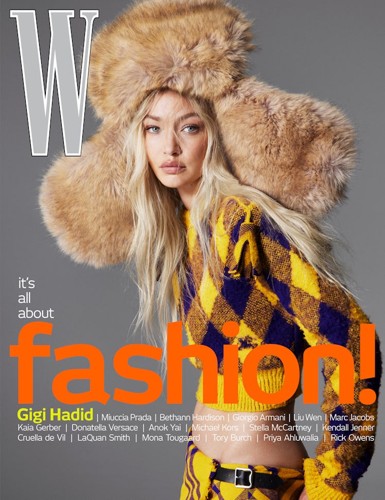 Hadid wears a Burberry sweater, kilt, and hat.