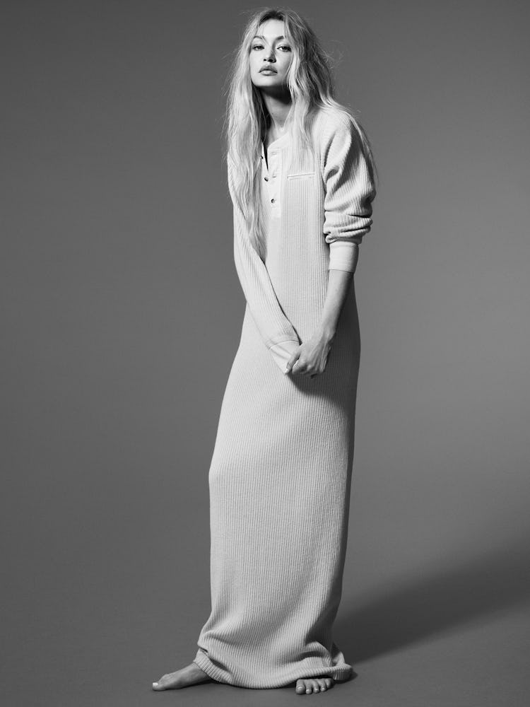 Model Gigi Hadid wears a white loose long john dress.