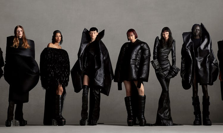Models wearing black high boots; black dress; black puffy coat; black leather jacket; 