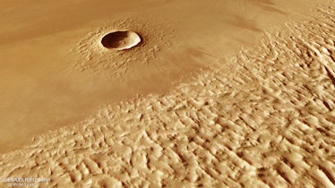 This tan-coloured patch of Mars's surface is split visually in two on the diagonal from lower left t...