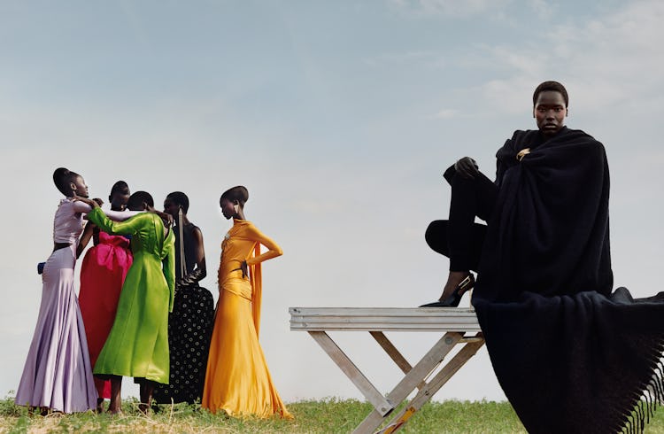 Models Nyawurh, Chuol, Jok, Odihang & Akway wearing violet silk dress; yellow silk dress; green silk...