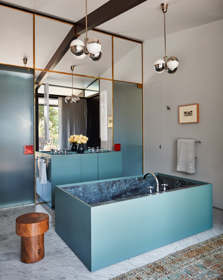 A bathroom with turquoise details.
