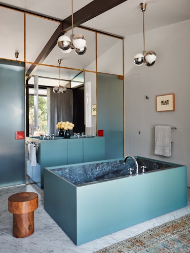 A bathroom with turquoise details.