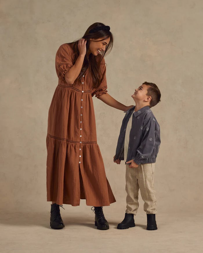 Woman and child pose for photoshoot, in a story about family fall photoshoot outfits