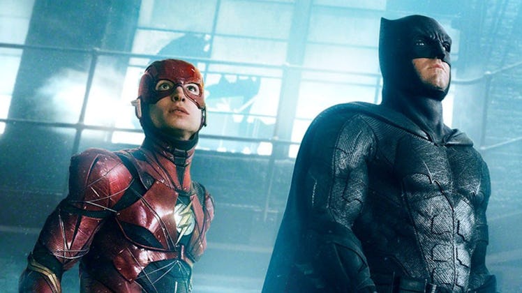 Ezra Miller as The Flash with Ben Affleck as Batman in 2017’s Justice League.