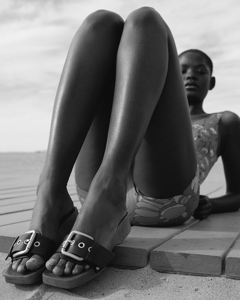 A model sitting with her feet up