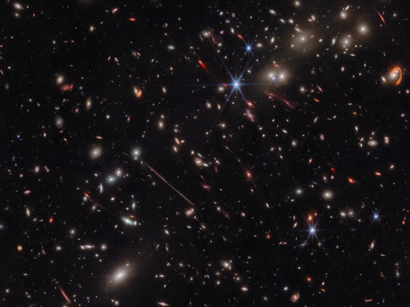Spheres with bright centers are galaxies within a community called El Gordo. Within the image are st...