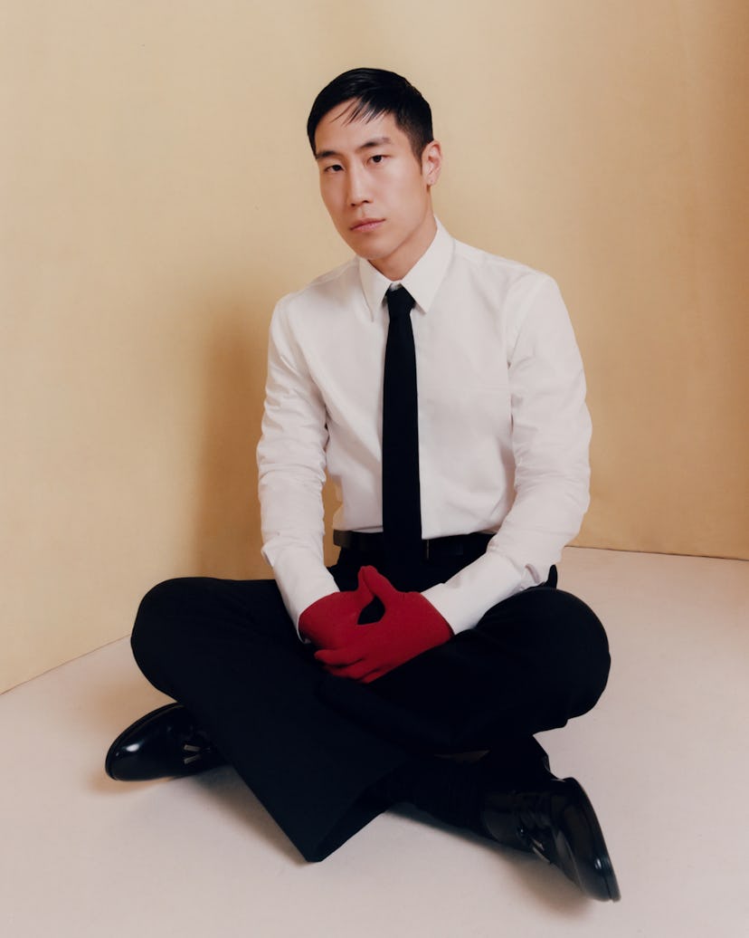 Mazino wears a Ferragamo shirt, tie, trousers, gloves, and shoes; Rebecca Turbow belt.