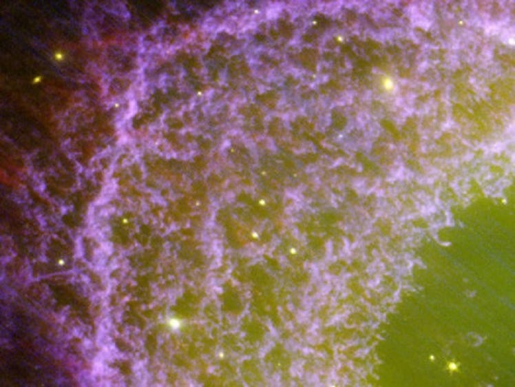 purple clouds of clumpy gas fading towards a clear green center