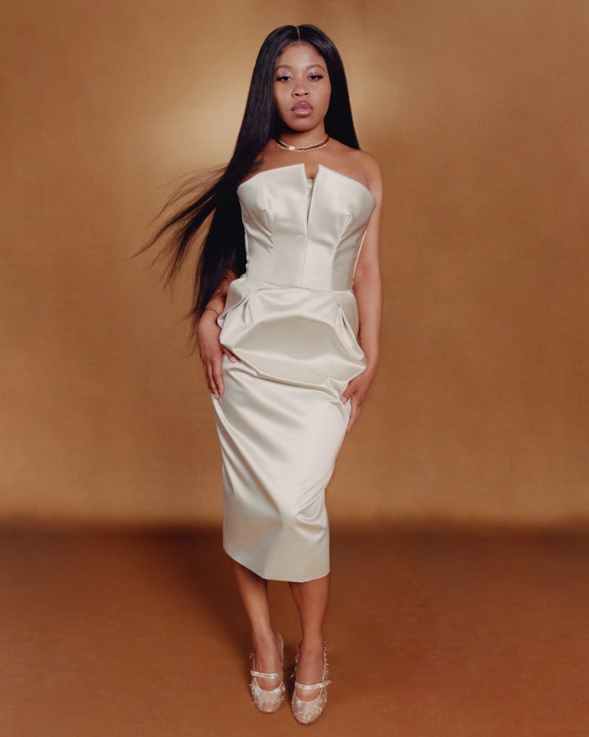 Fishback wears Maison Margiela dress and shoes; Van Cleef necklace.