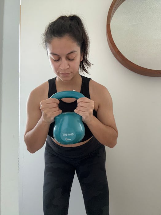 A yoga instructor tries Beyonce’s strength training workout, which includes a kettlebell.