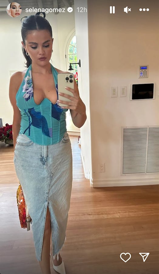 Selena Gomez wears a floral bustier and a denim midi skirt in a photo posted to her Instagram story.
