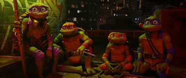 Donatello, Raphael, Michelangelo, and Leonardo sit on a rooftop together in 'TMNT: Mutant Mayhem'