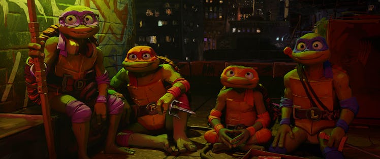 Donatello, Raphael, Michelangelo, and Leonardo sit on a rooftop together in 'TMNT: Mutant Mayhem'