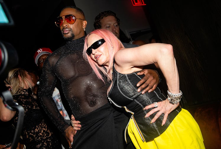 Singer Madonna and designer LaQuan Smith pose together for photographs.
