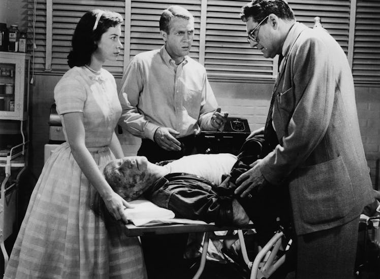 Aneta Corseaut and Steve McQueen present as doctor examines victim of the Blob in a scene from the f...