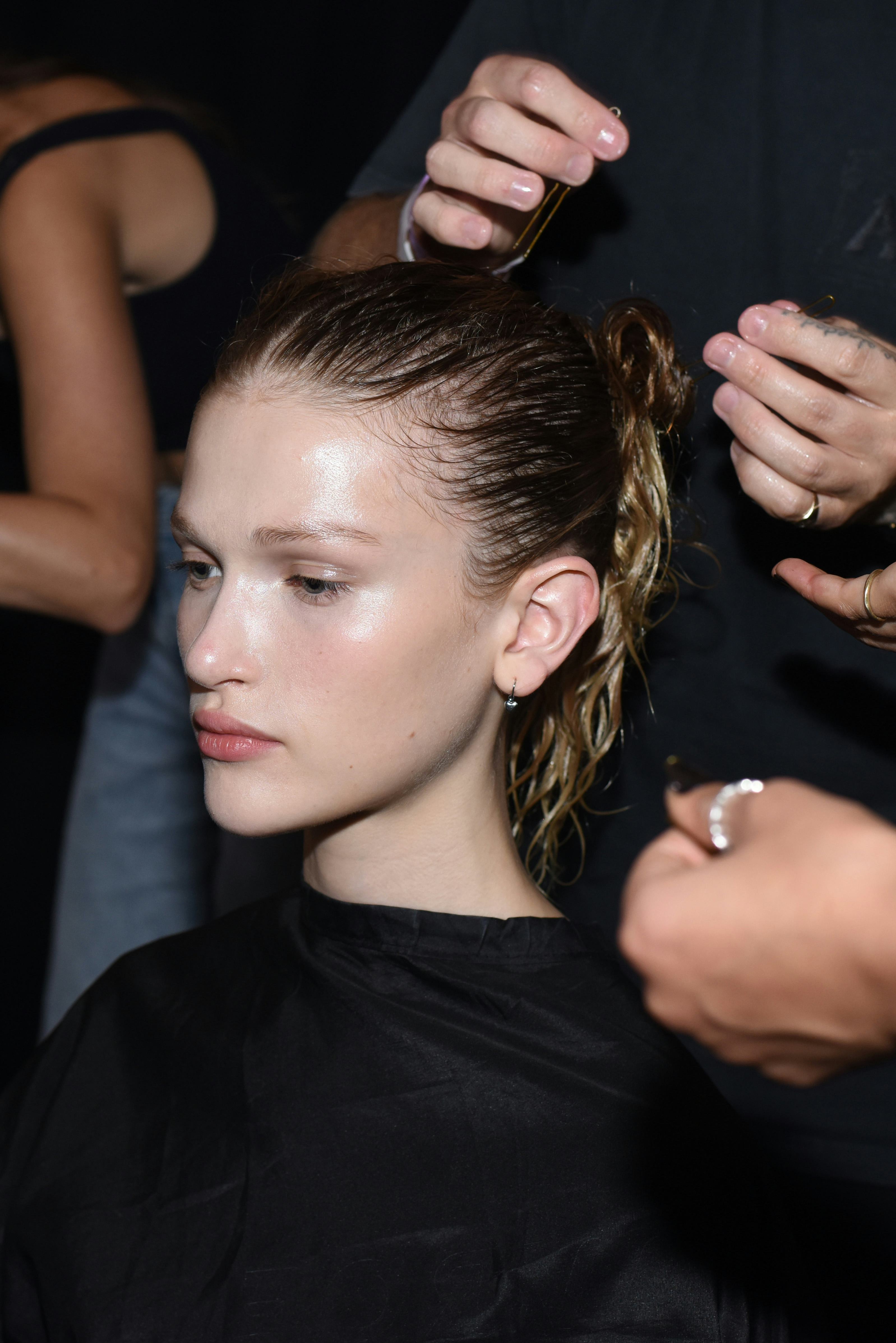 The slick low bun at Khaite&rsquo;s S/S &lsquo;24 show.