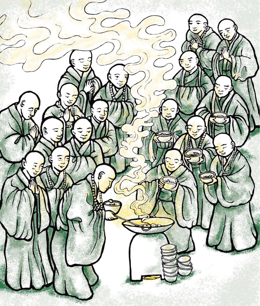 Pictured is a group of monks sharing food together.