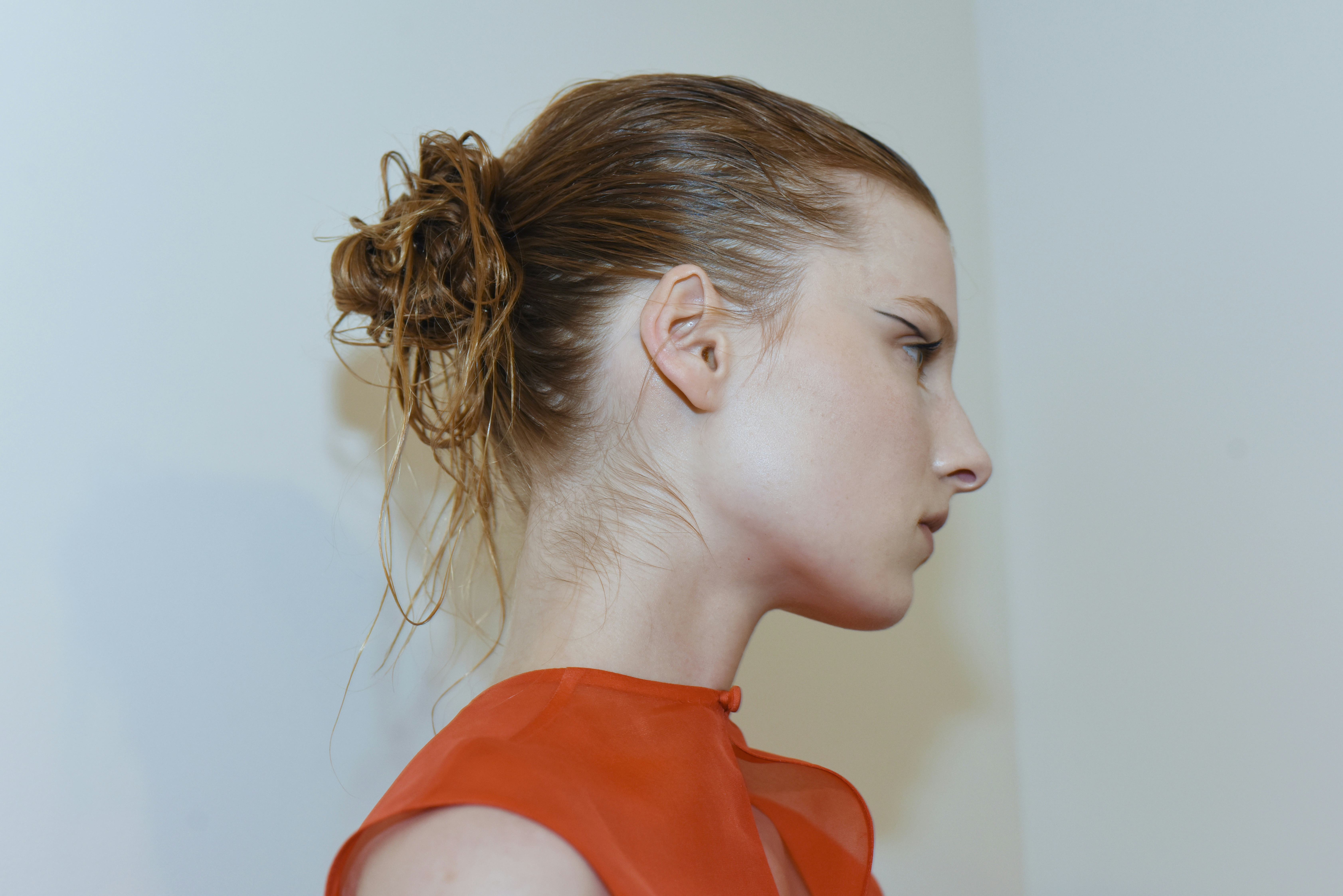 The slicked back low bun at Khaite.