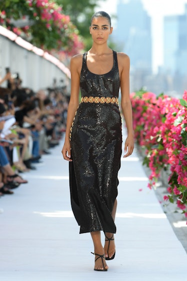 Model on the runway at Michael Kors Spring 2024 Ready To Wear Fashion Show at Domino Park on Septemb...