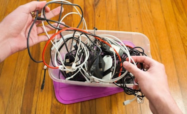 a tangled box full of charging cables.