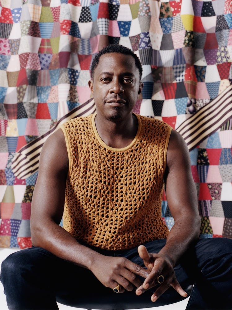 Sanford Biggers sits in his studio