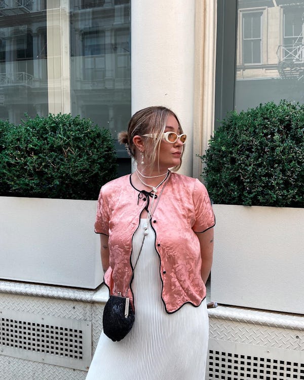 kelsey stiegman wears a pink top and pleated dress for new york fashion week september 2023