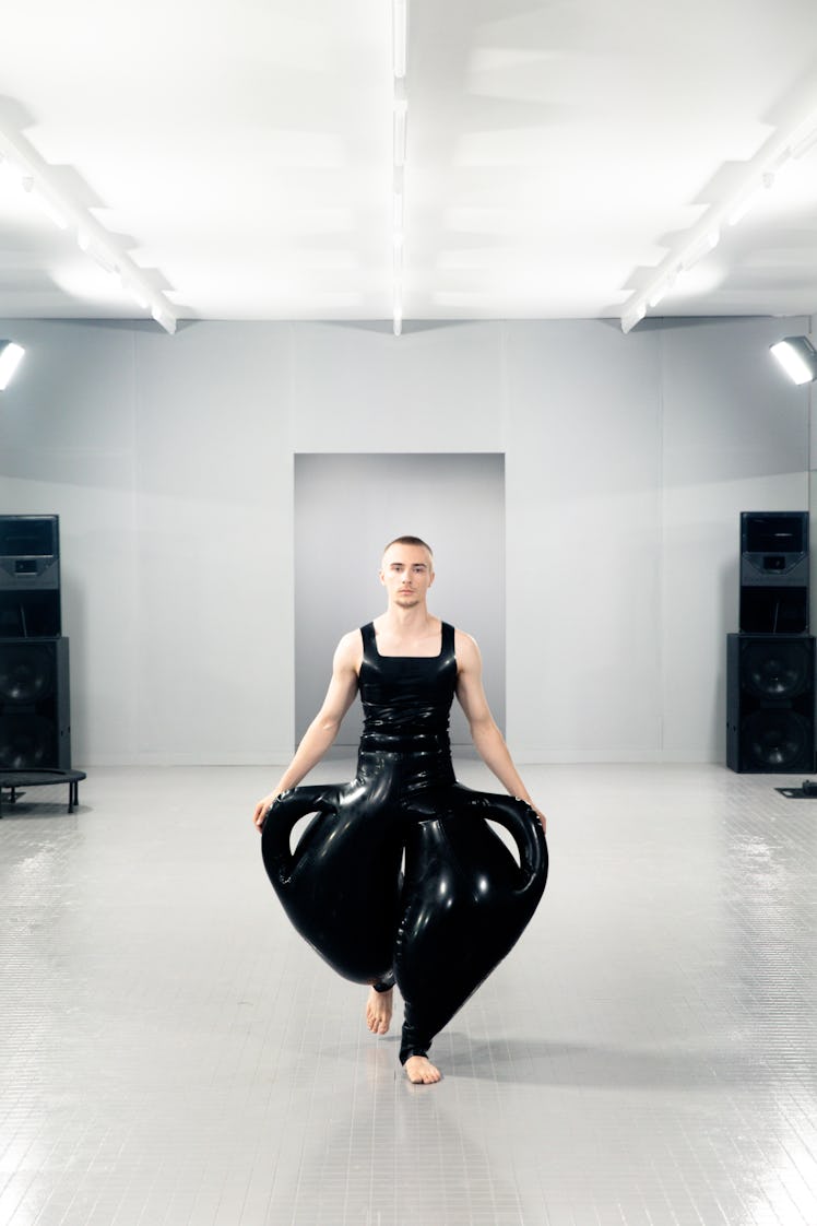 A model wearing a sculptural latex outfit
