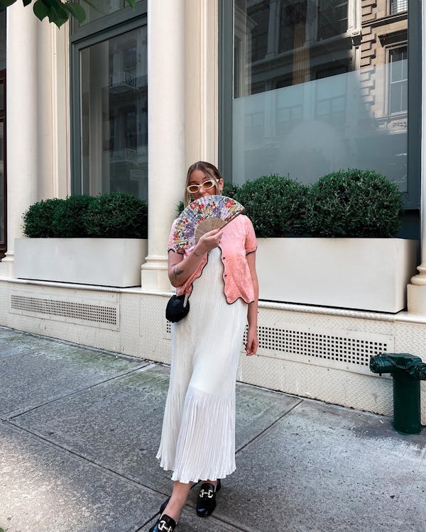 kelsey stiegman wears a pink top and pleated dress for new york fashion week september 2023