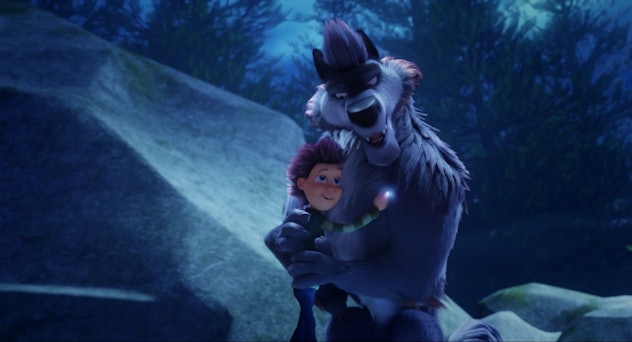 A boy and a werewolf hug in '100% Wolf,' a Halloween movie for kids that isn't scary.