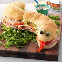 birthday party food idea: turn a long subway sandwich into a snake 