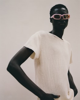 a model wearing pink rectangular sunglasses