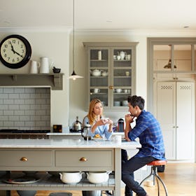 Couple sitting at breakfast table having an intense converation