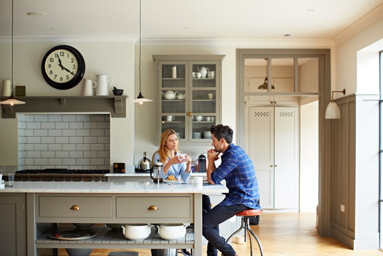 Couple sitting at breakfast table having an intense converation