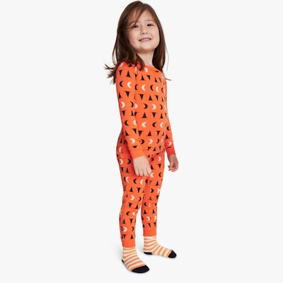 Kids halloween pajamas in orange and black moon pattern