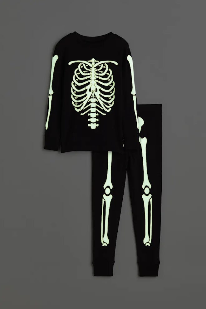 Glow in the dark halloween pajamas for kids with a glowing skeleton print