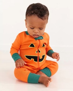 Halloween pajamas for baby that look like a jack-o-lantern face