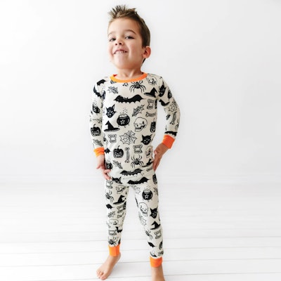 Toddler halloween pajamas with orange trim and spooky pattern