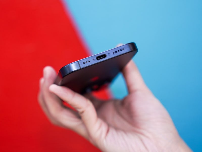 An iPhone 15 with a USB-C port.