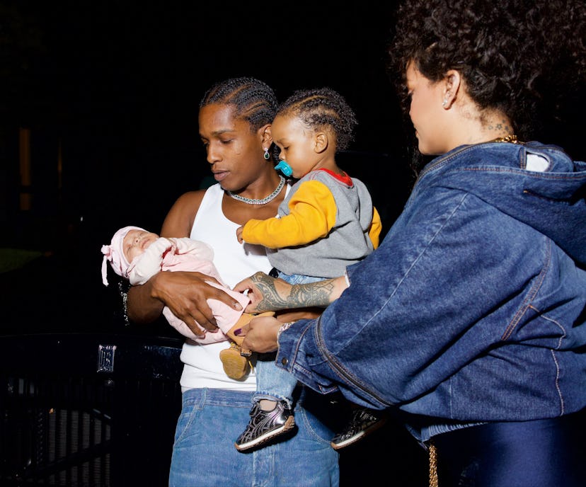 ASAP Rocky holding his two sons, RZA and Riot. 