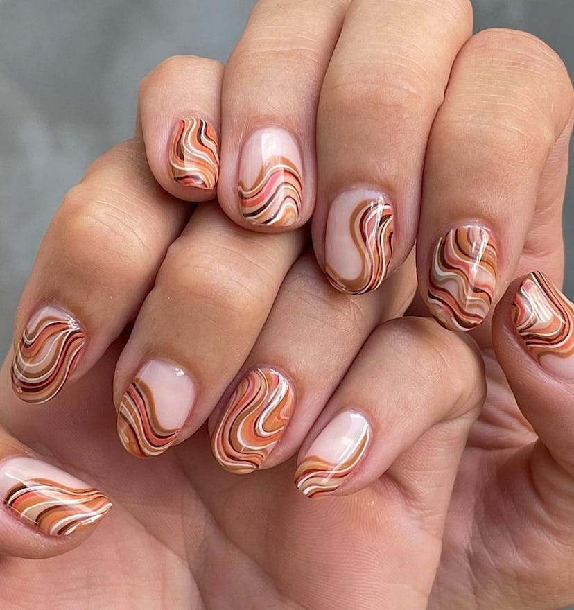 This fall, create a wavy design with caramel-colored nail polish hues.