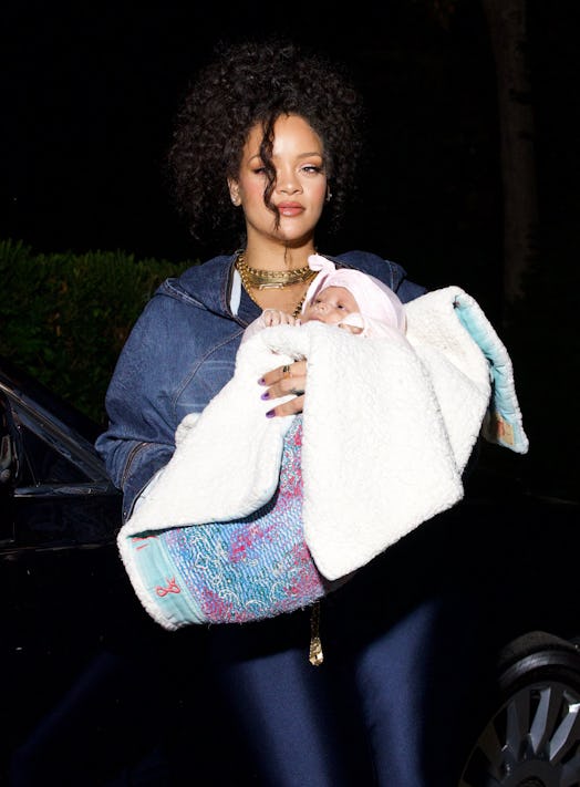 Rihanna holds her newborn son Riot.