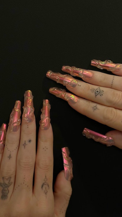 Megan Fox rose gold chrome nails with 3D