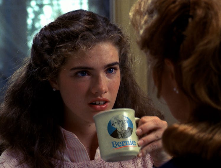 a person holding a mug with bernie sanders's face on it