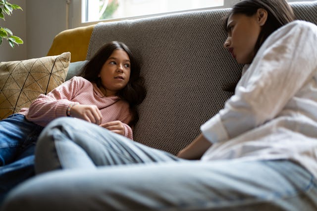 A mother has a serious conversation with her tween daughter.