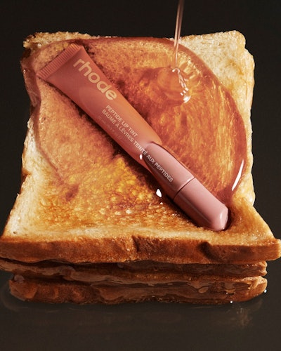 Hailey Bieber Rhode Peptide Lip Tint in Toast