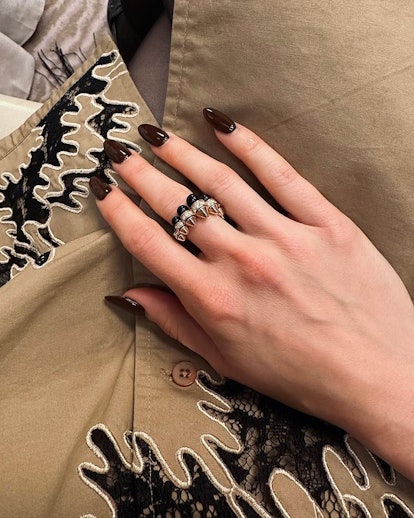 Lily Collins dark brown nail polish