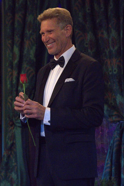 Gerry Turner, the Golden Bachelor, handing out a rose