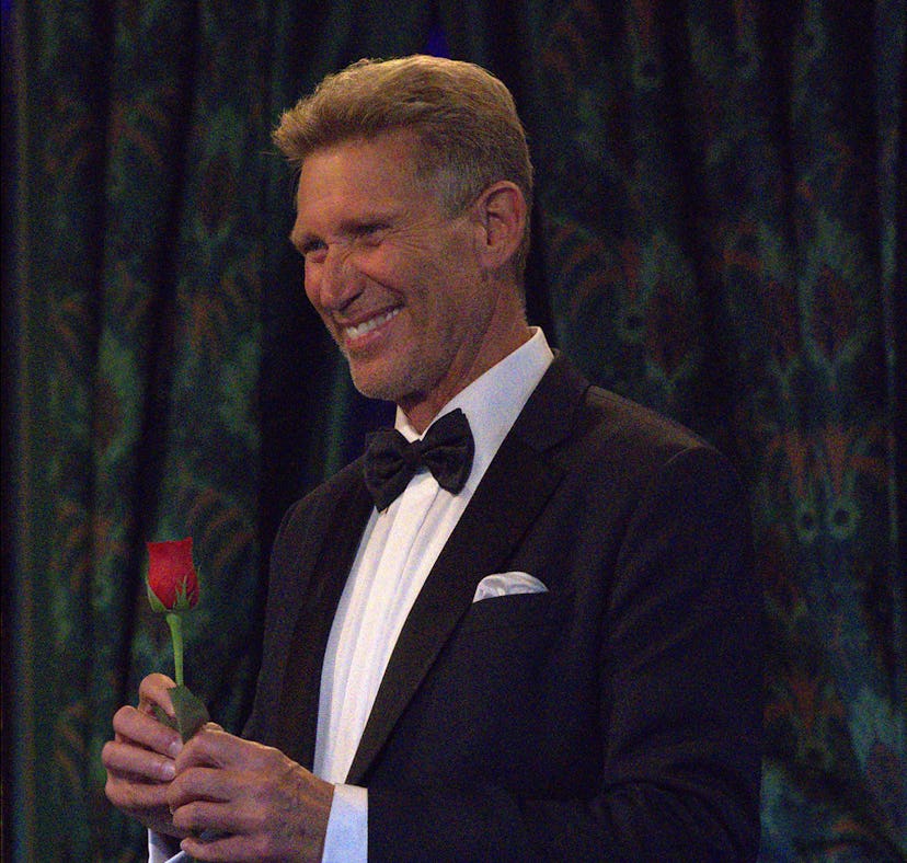 Gerry Turner, the Golden Bachelor, handing out a rose
